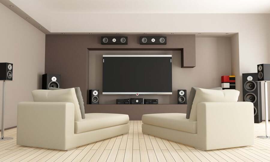 A home theater space with a surround sound system in place.